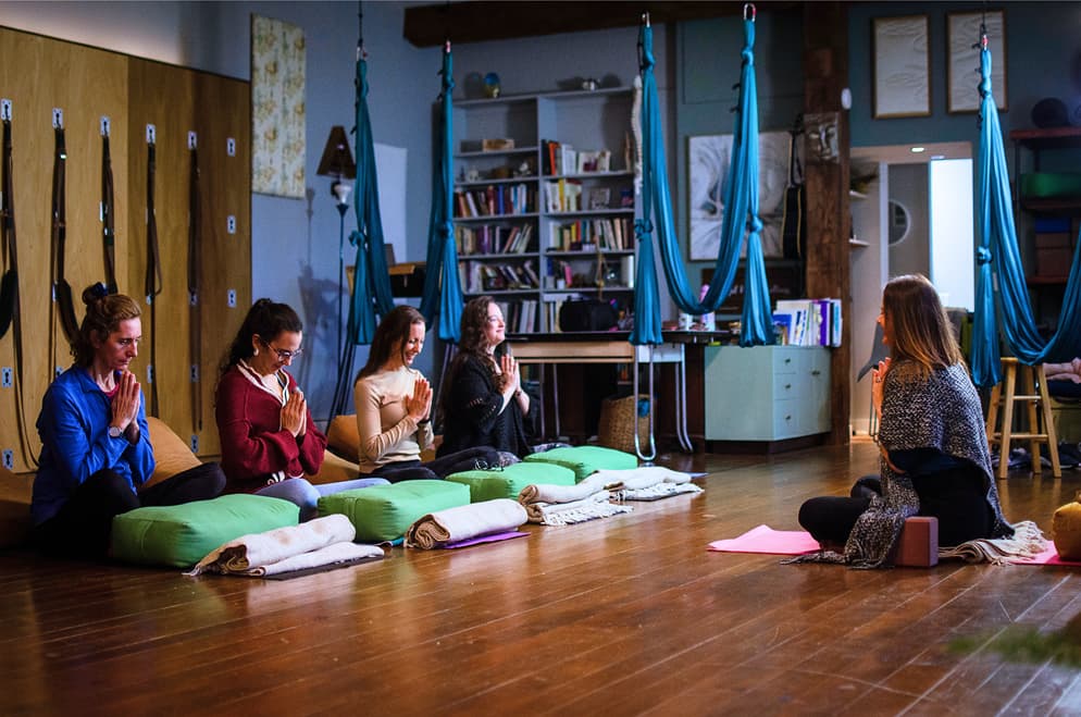 students in yoga teacher training class in Kent, Ohio learning meditation