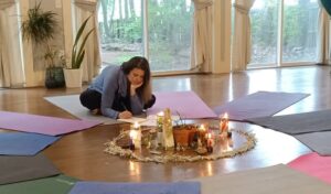 Nichole at Mindful Heart Wellness in her yoga studio preparing for a wellness course